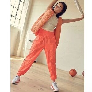 Free People The Way Home Joggers 100% Nylon Size M Women’s Elastic Waist Orange